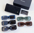 Set of five square sunglasses in blue, navy, green, and brown frames with tinted lenses