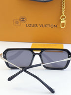 Louis Vuitton sunglasses close-up: black frame with blue lenses