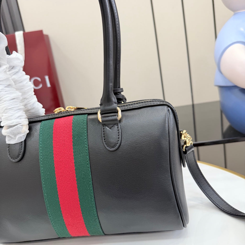 Gucci satchel bag in black leather with green-and-red web stripe and top handle