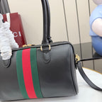 Gucci satchel bag in black leather with green-and-red web stripe and top handle