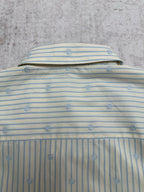 Light blue striped shirt back with top button and small emblem pattern
