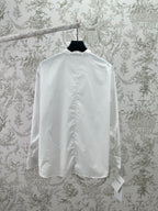White long-sleeve button-up shirt, back view with straight yoke seam