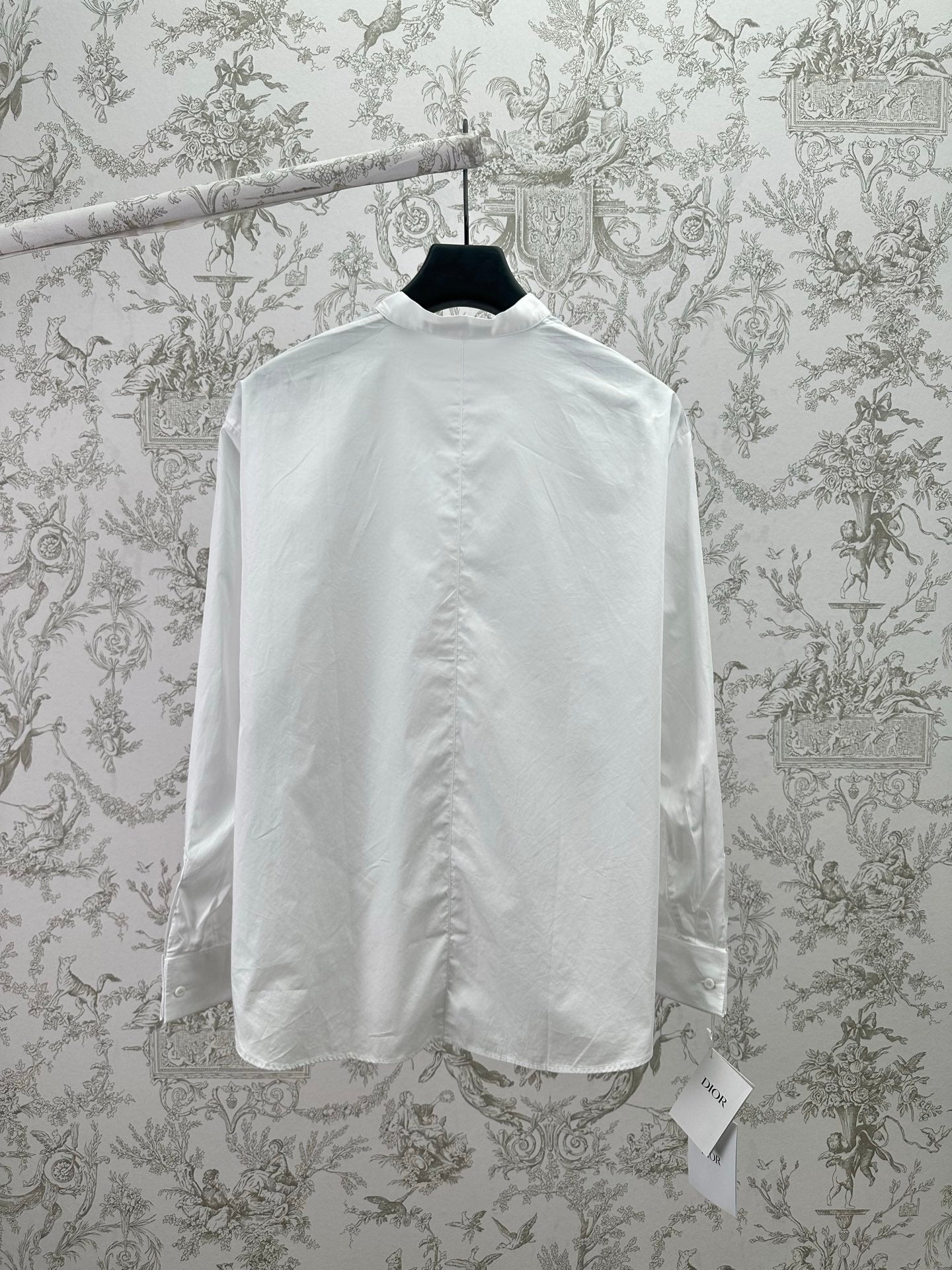 White long-sleeve button-up shirt, back view with straight yoke seam