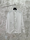White long-sleeve button-up shirt with pointed collar and small chest logo
