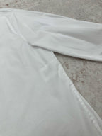 White long-sleeve shirt with smooth fabric and side seam detail