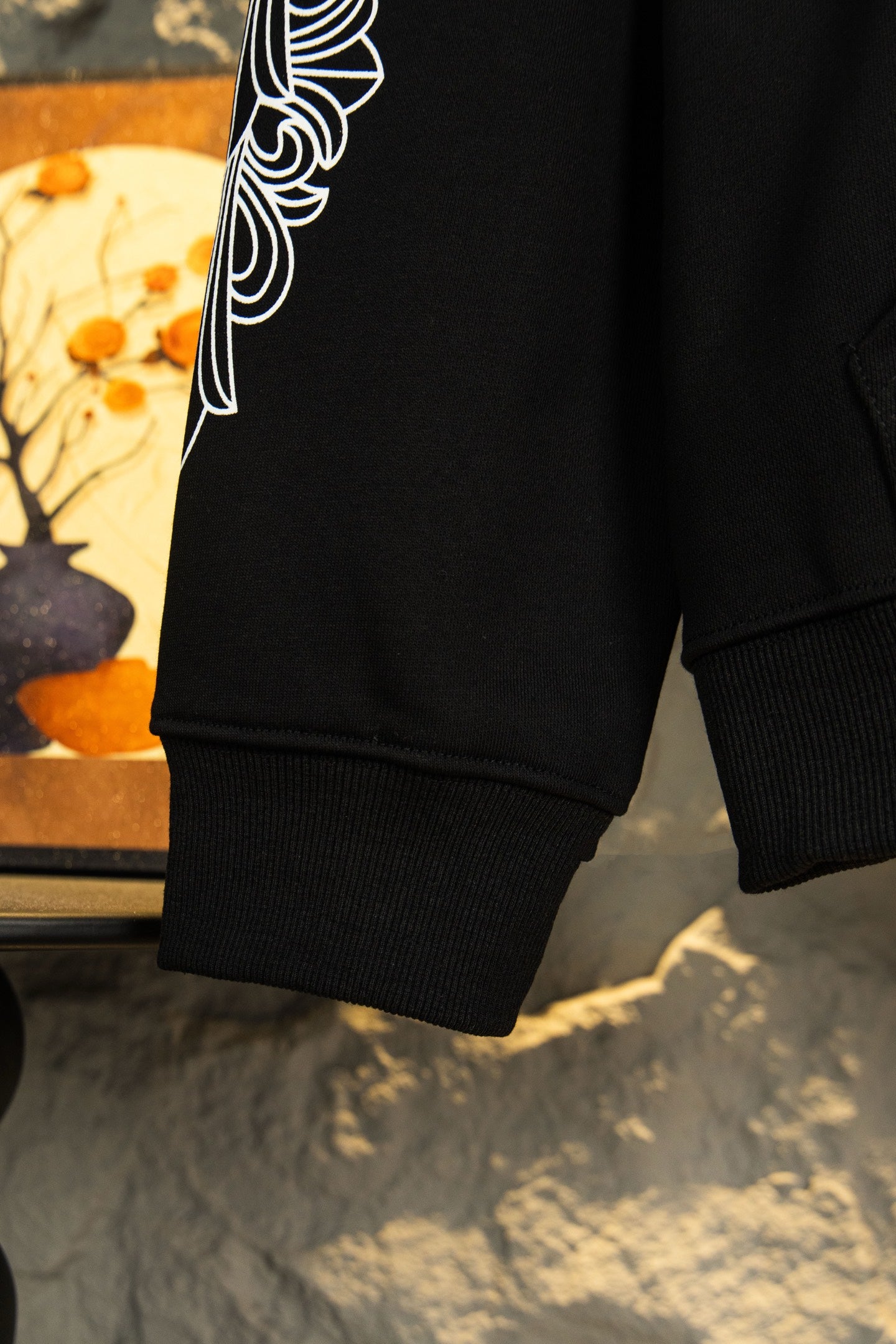 Black hoodie sleeve cuff and hem with ribbed knit detail