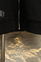 Black hoodie front hem with zipper seam detail