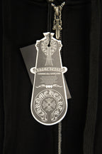 Black hoodie close-up with hanging logo tag on the front zipper