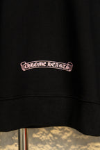 Black hoodie chest logo in pink