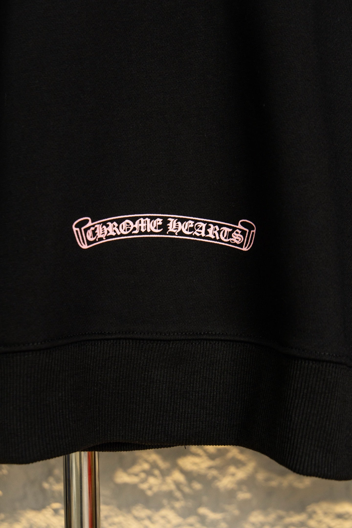 Black hoodie chest logo in pink
