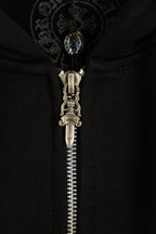 Black hoodie with detailed metal zipper and ornate hood drawstring pull.