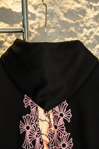 Black hoodie hood with pink floral graphic