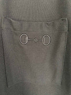 Close-up of Gucci inner neck label on a dark crew-neck T-shirt