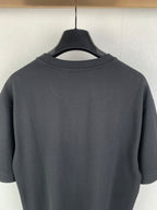 Dark charcoal crew-neck T-shirt back with clean neckline and smooth fabric