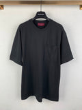 Dark charcoal crew-neck T-shirt with short sleeves and a chest pocket
