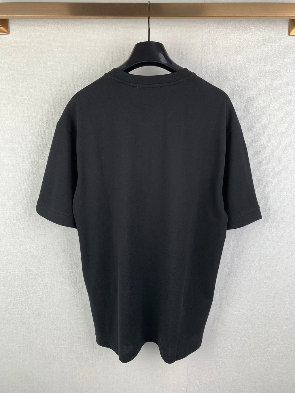 Dark charcoal crew-neck short-sleeve T-shirt, back view