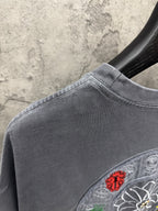 Grey T-shirt with ribbed crew neck and embroidered shoulder patch detail