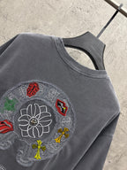 Grey T-shirt close-up of large embroidered back graphic with floral motif