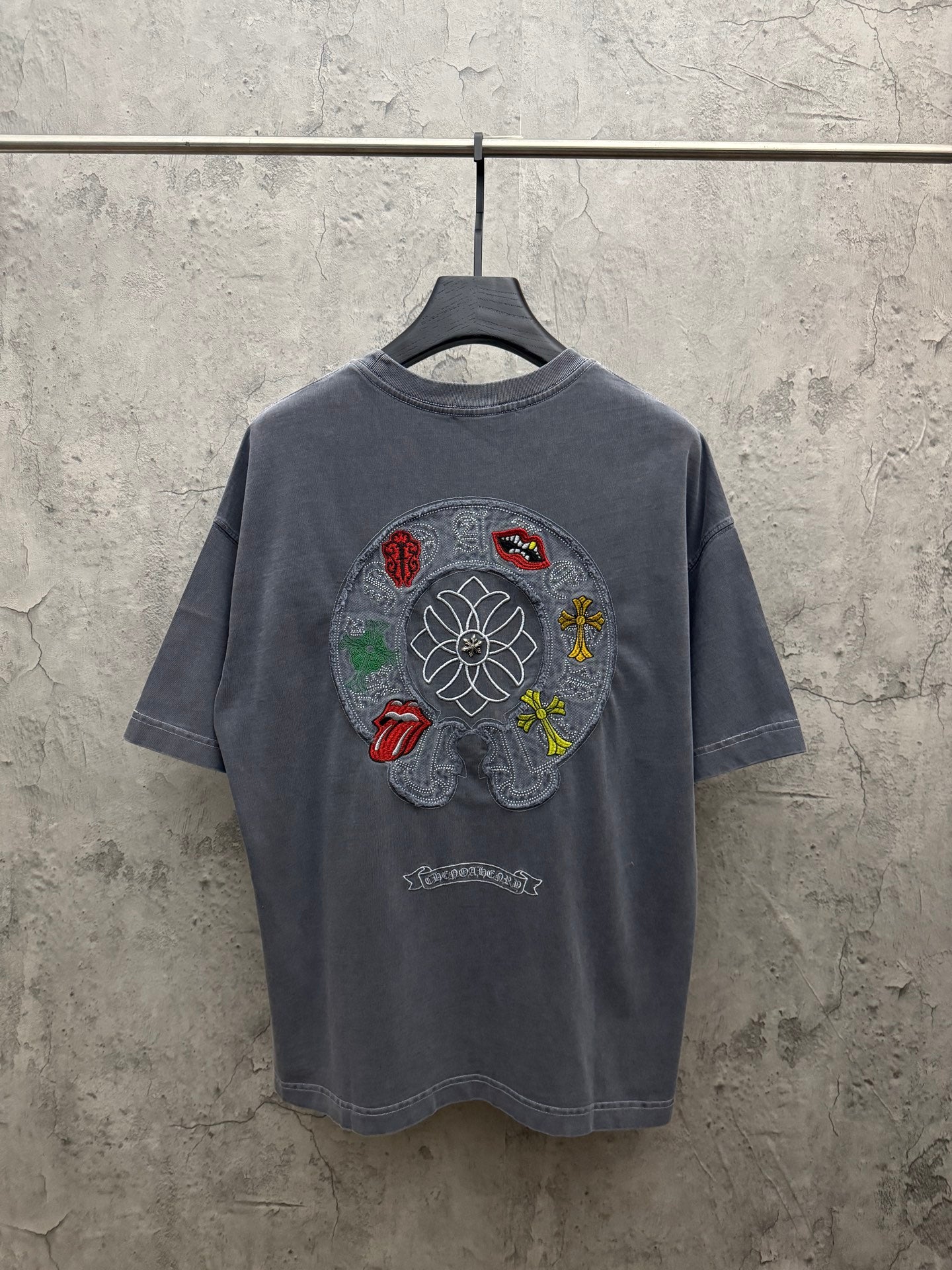 Grey short-sleeve T-shirt with large back-center embroidered graphic