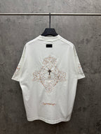 White short-sleeve T-shirt with large back cross embroidery and decorative script at hem