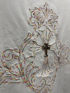 White short-sleeve T-shirt embroidery close-up of ornate cross with colorful thread accents