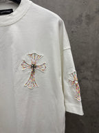 White short-sleeve T-shirt with cross embroidery on chest and matching sleeve motif