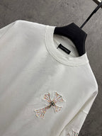 White short-sleeve T-shirt close-up of chest cross embroidery and crew neckline