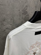 White short-sleeve T-shirt back view with small chest embroidery and black neck label