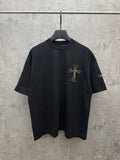Black short-sleeve T-shirt with colorful cross embroidery on left chest