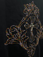 Black short-sleeve T-shirt close-up of colorful cross and floral embroidery