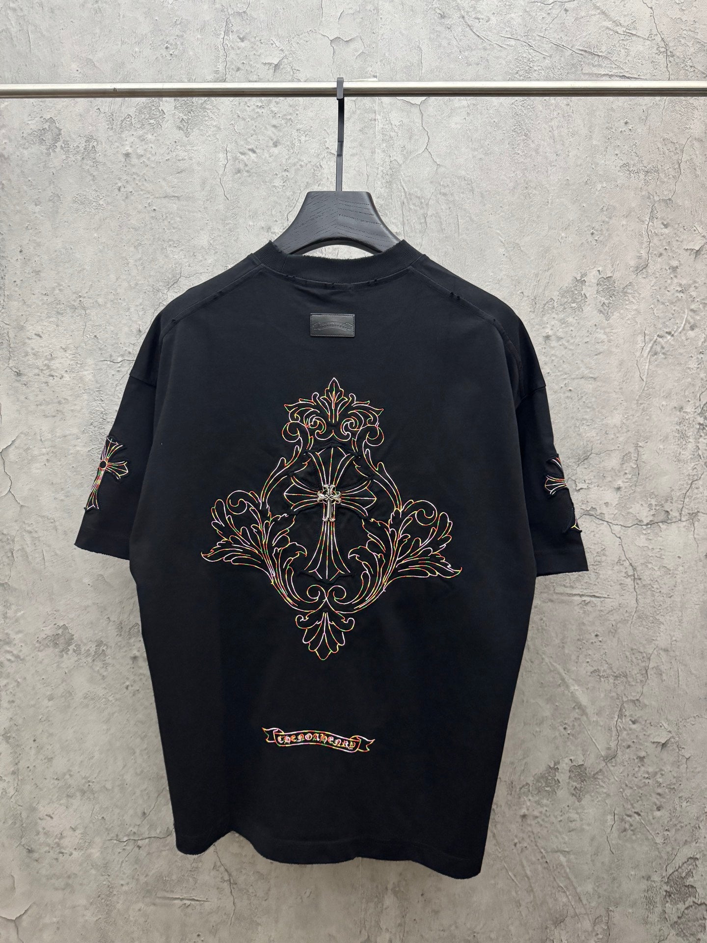 Black short-sleeve T-shirt with ornate cross embroidery on upper back