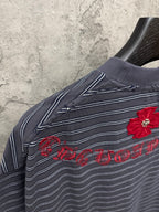Navy striped short-sleeve shirt with red flower and script embroidery on shoulder