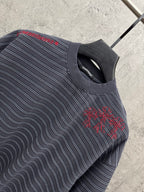 Navy striped short-sleeve shirt with red cross-stitch embroidery at side seam