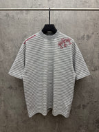 Striped short-sleeve T-shirt with red floral embroidery on chest, crew neck.