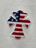 Embroidered patriotic angel figure with stars-and-stripes colors on white fabric