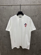 White short-sleeve T-shirt with small embroidered patriotic figure on left chest
