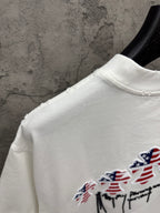 White T-shirt side/back view with embroidered patriotic figure graphic