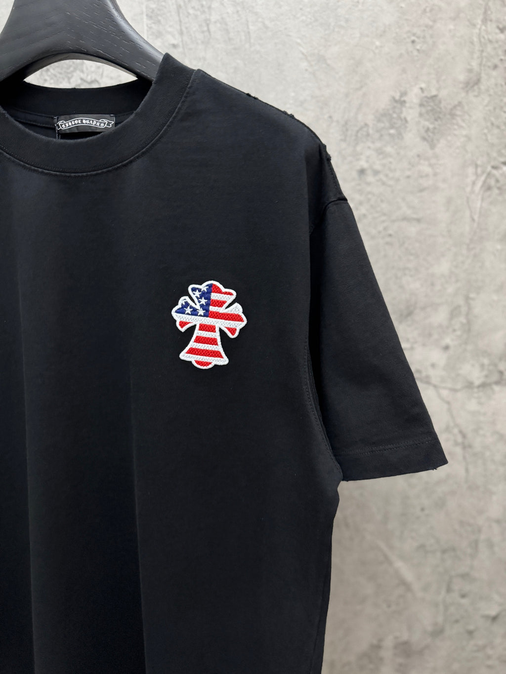 Black short-sleeve T-shirt with chest USA angel patch and crew neck
