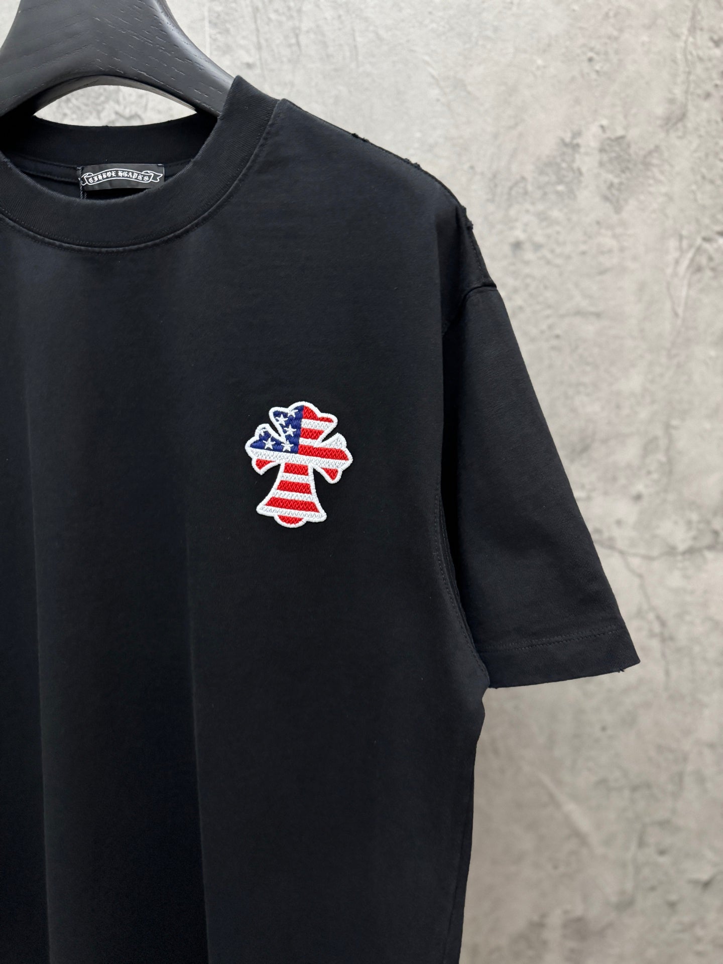 Black short-sleeve T-shirt with chest USA angel patch and crew neck
