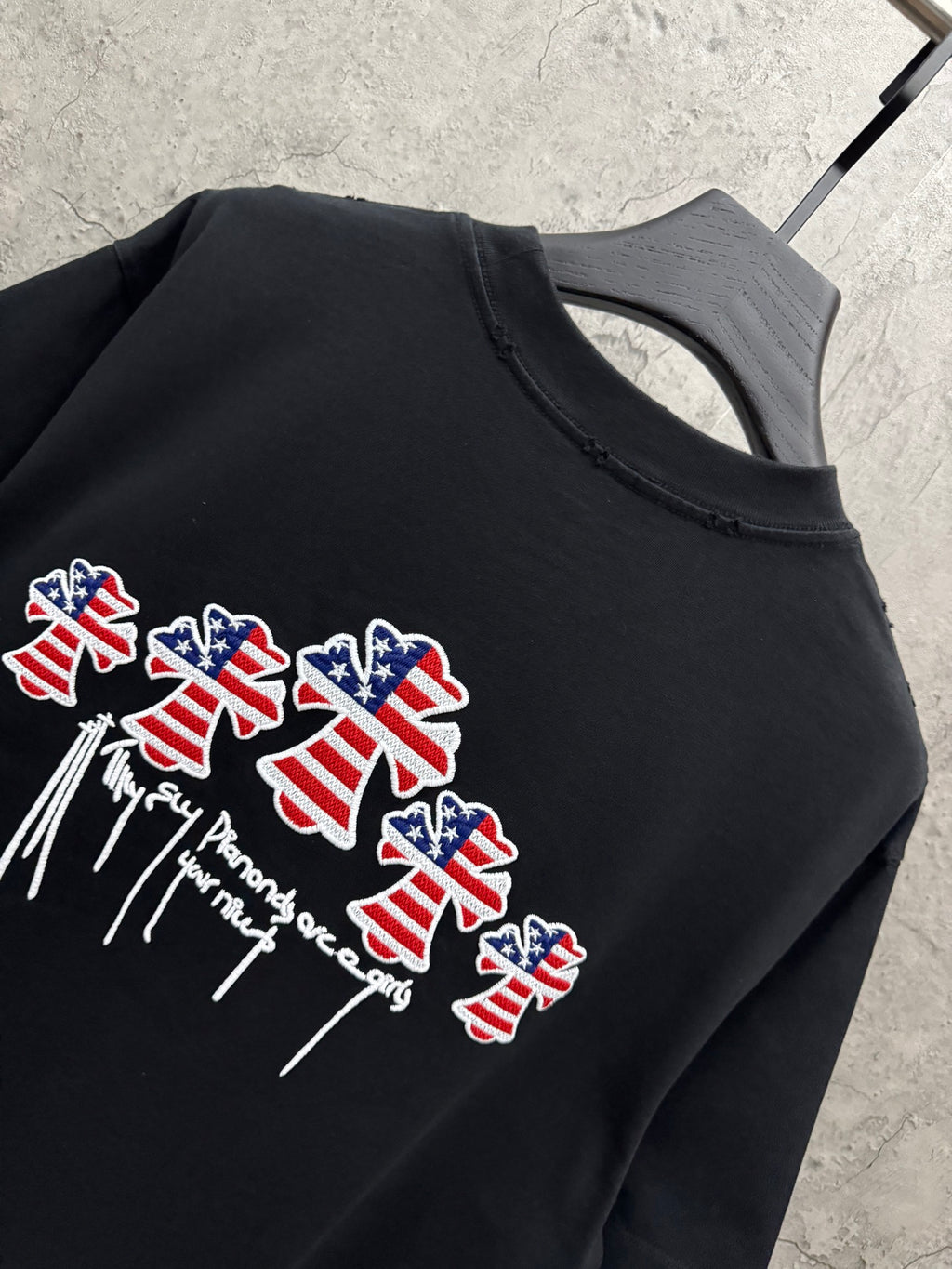 Close-up of black T-shirt back graphic with USA angels and drippy text