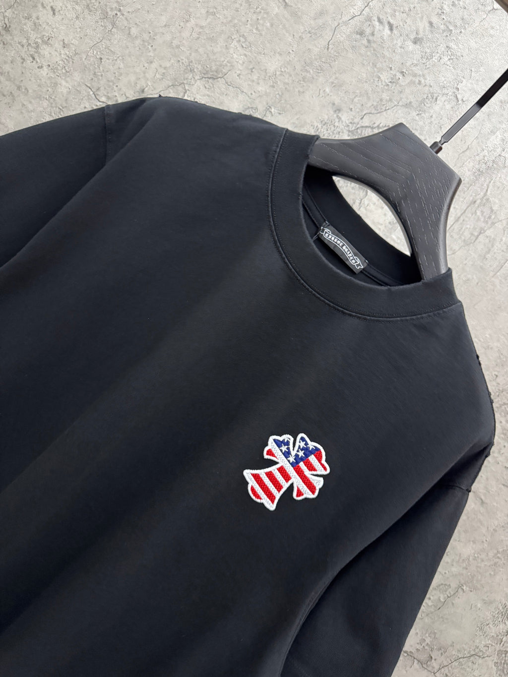 Close-up of black short-sleeve T-shirt chest graphic and crew neckline