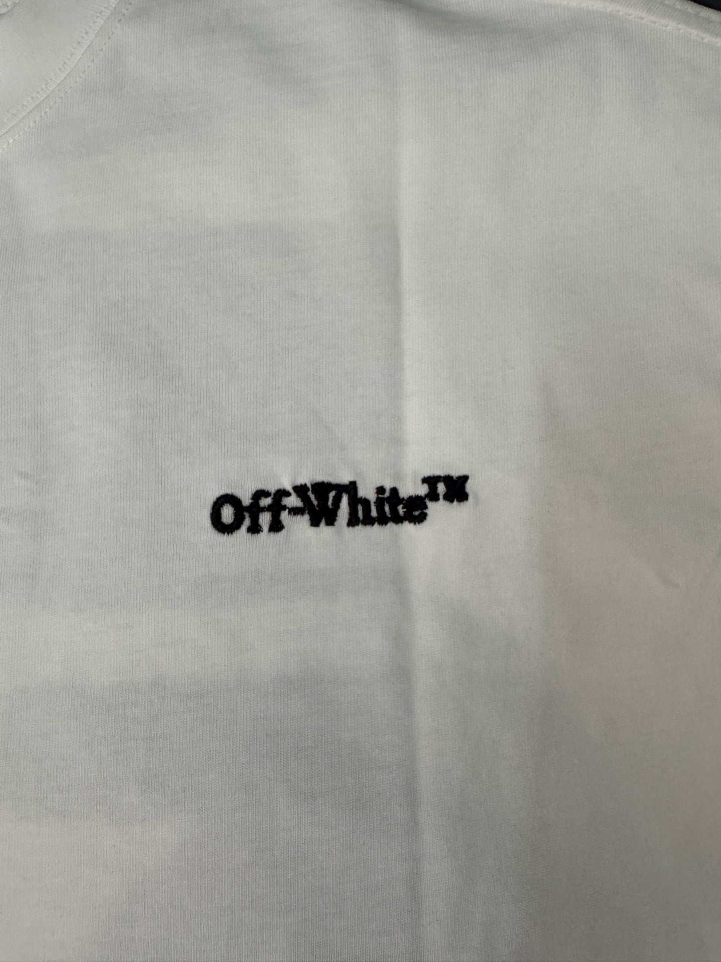 Off-White logo text on off-white T-shirt front, crewneck