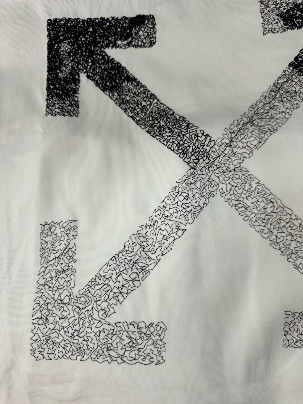 Off-white T-shirt with close-up large X print in speckled graphic texture