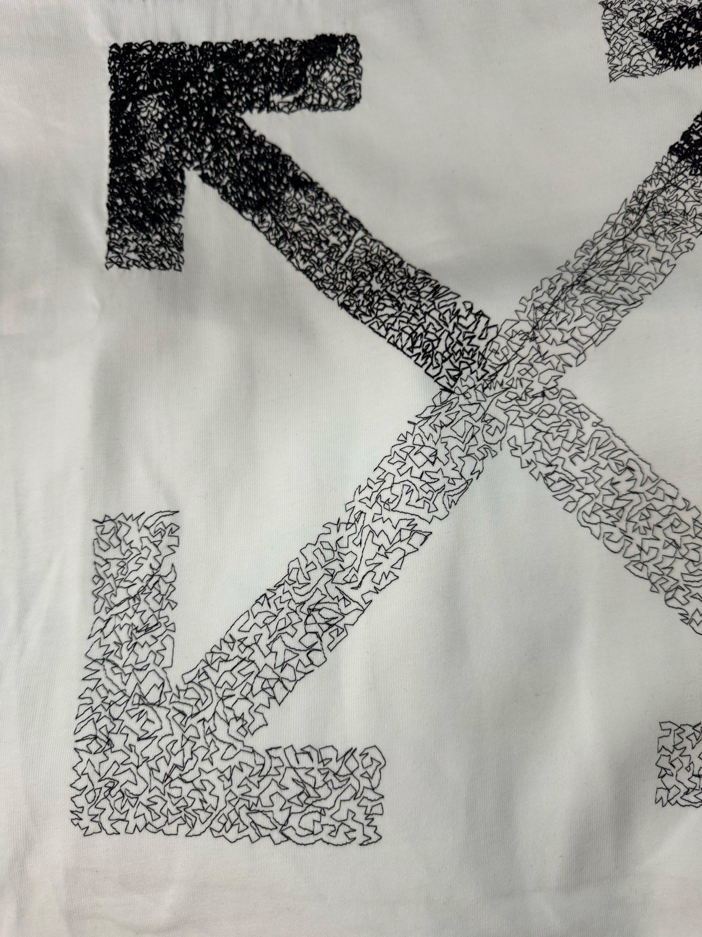 Off-white T-shirt with close-up large X print in speckled graphic texture
