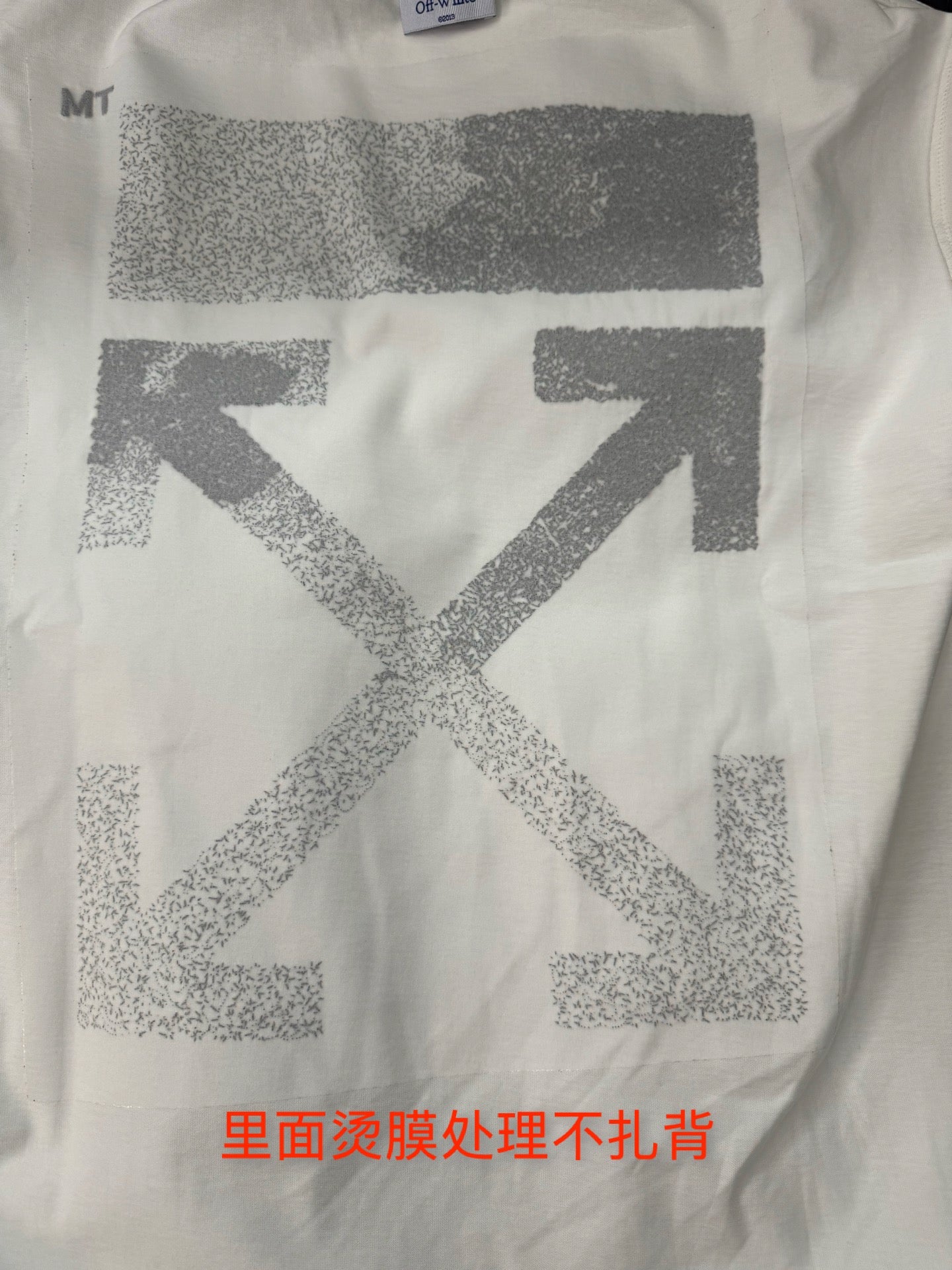 Off-White graphic T-shirt with large X print and orange text at hem