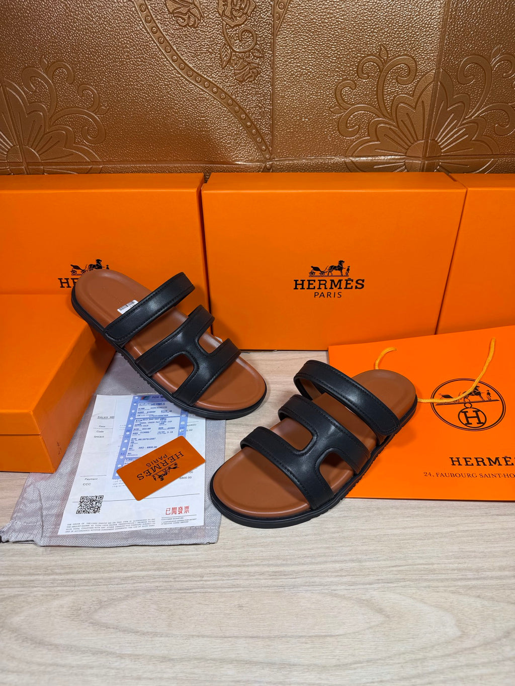 Hermes dark leather slide sandals with double strap bands, side view