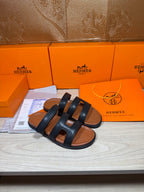 Hermes dark leather slide sandals with wide double straps, open toe