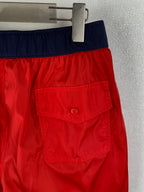 Moncler red shorts with navy waistband and stitched front patch pocket detail