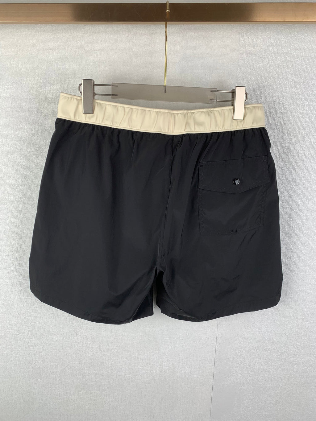 Moncler black swim shorts with cream waistband and front patch pocket