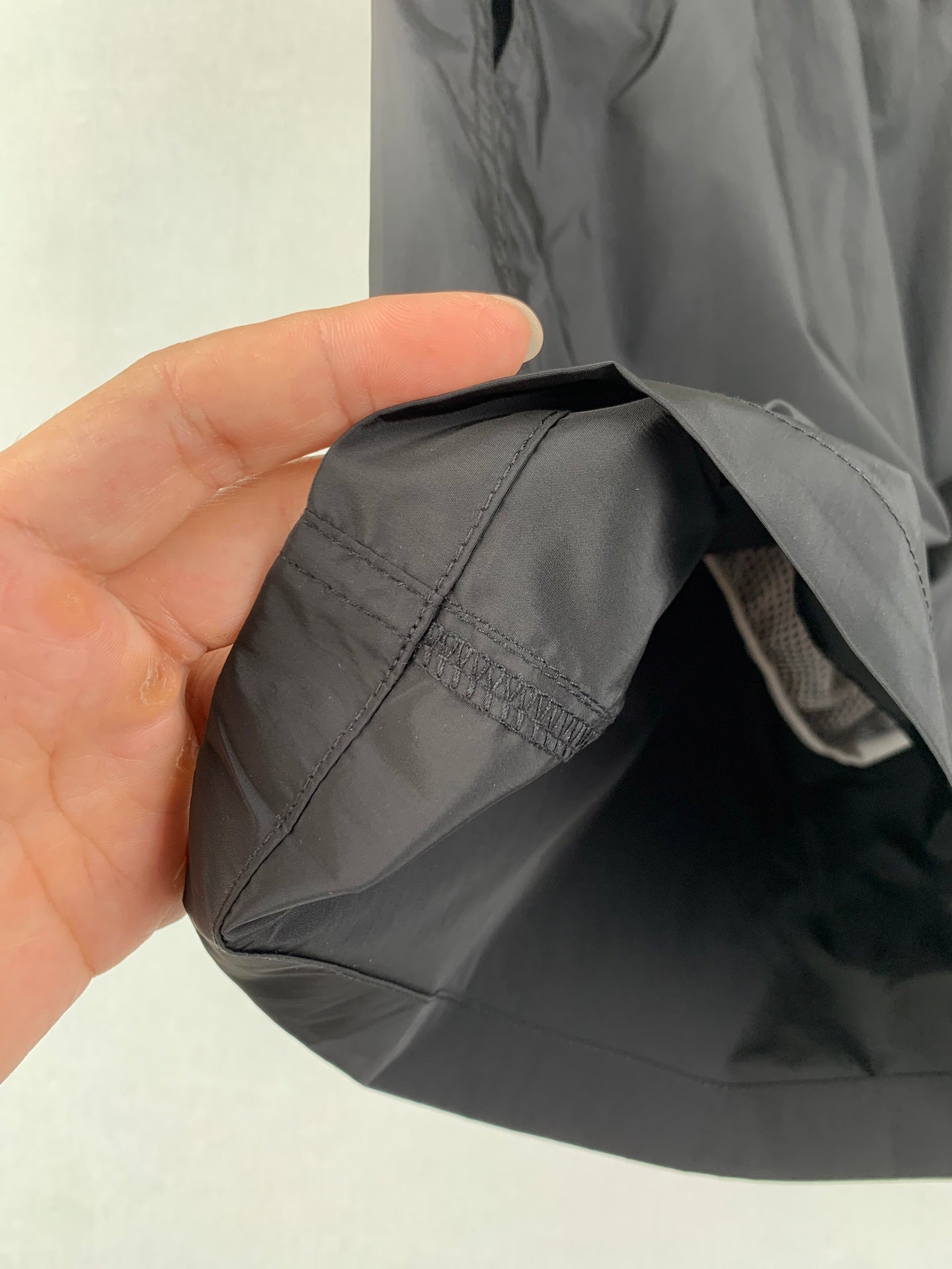 Moncler black swim shorts fabric close-up with inner seam detail